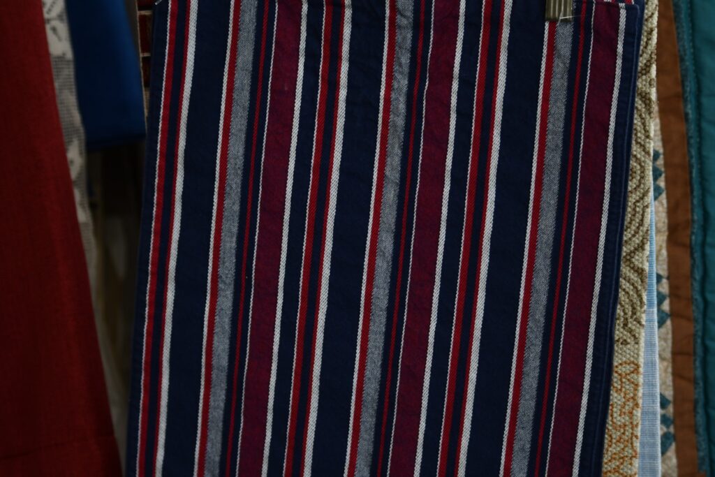 Striped fabric in navy, burgundy, and white.