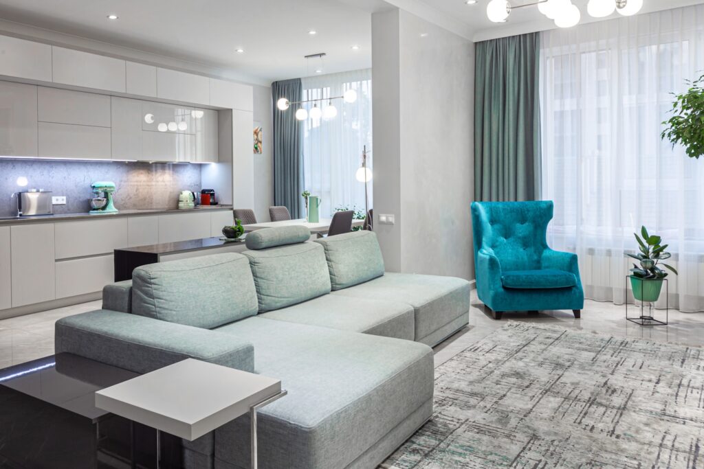 A living room filled with furniture and a blue chair