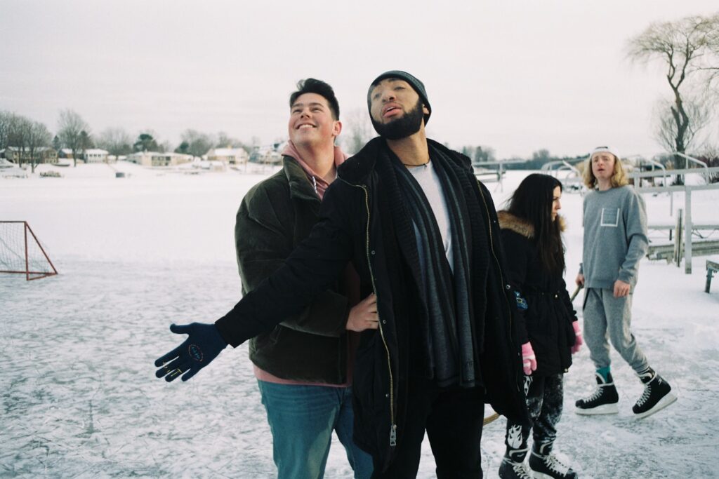 a group of people standing in the snow