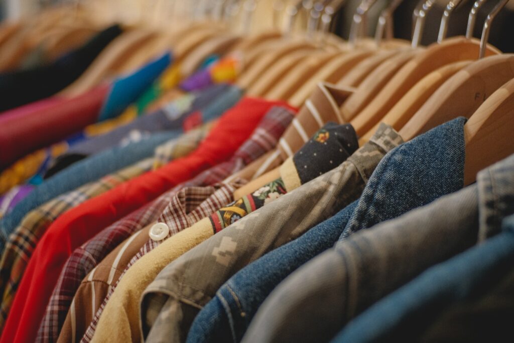 blue denim jeans on brown textile